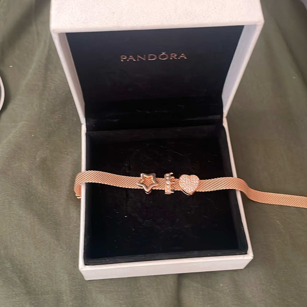 Pandora bracelet new in box with 3 charms